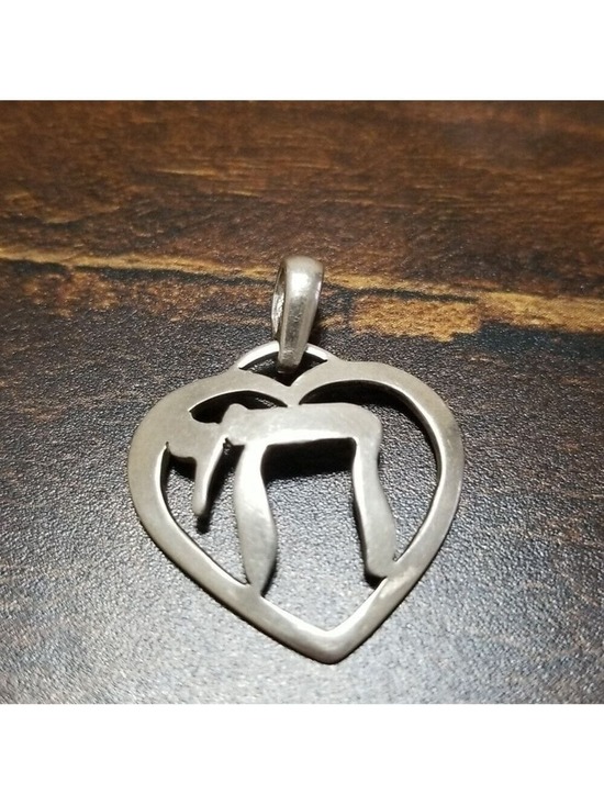 Jewelry - Sterling silver pendant, stamped 925,about an inch wide.
